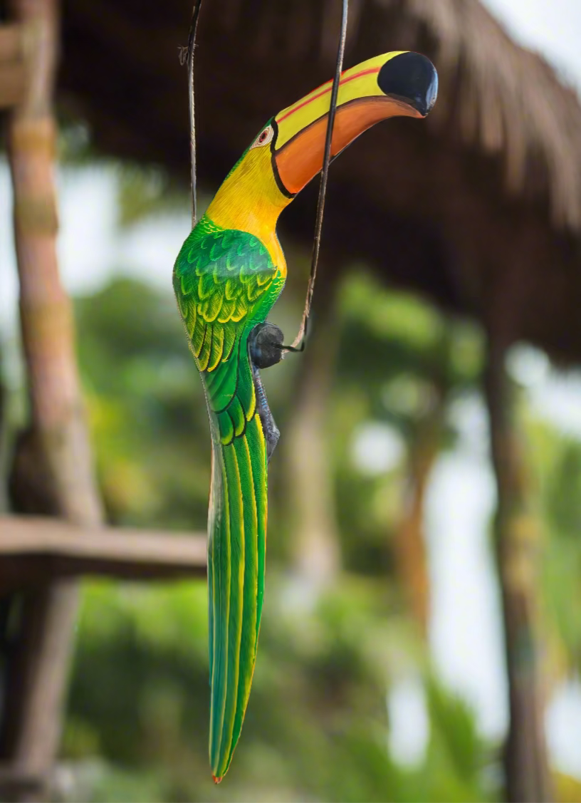 Decorative toucan bird hanging on a perch