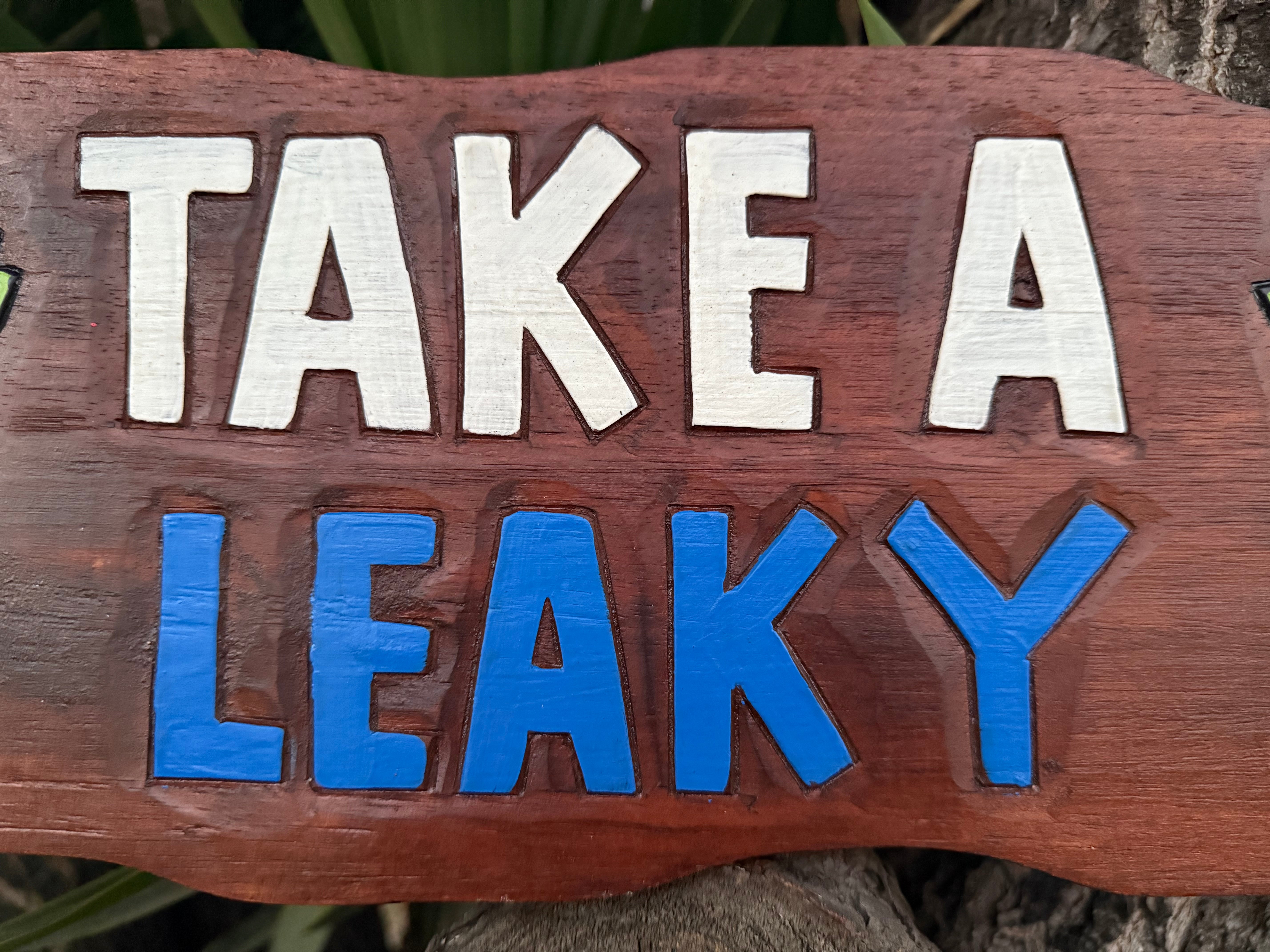 Take a Leaky Wood Carved Tropical Restroom Sign  22"x 8"