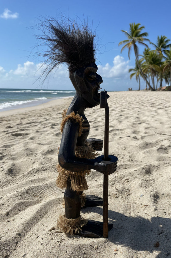 prim statue on beach
