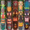 Set of colorful tiki masks with various designs against a natural background.