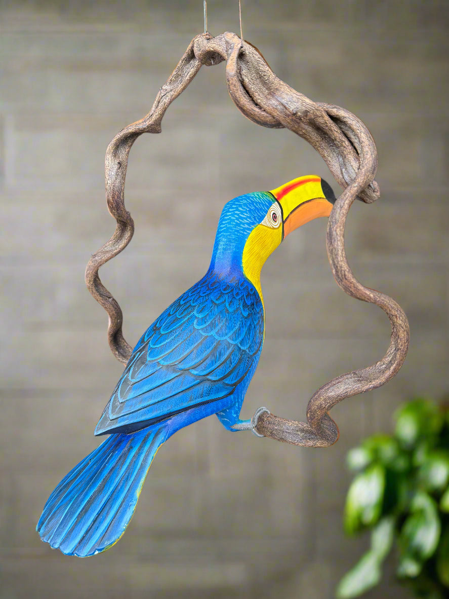 Blue-and-yellow macaw perched on a twisted wooden ring.