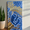 Blue Buddha head with gold ornate crown and lotus motif