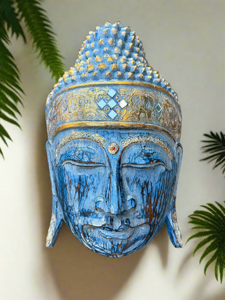 Blue Buddha head statue with gold ornate crown and jewel accents, decorative sculpture.