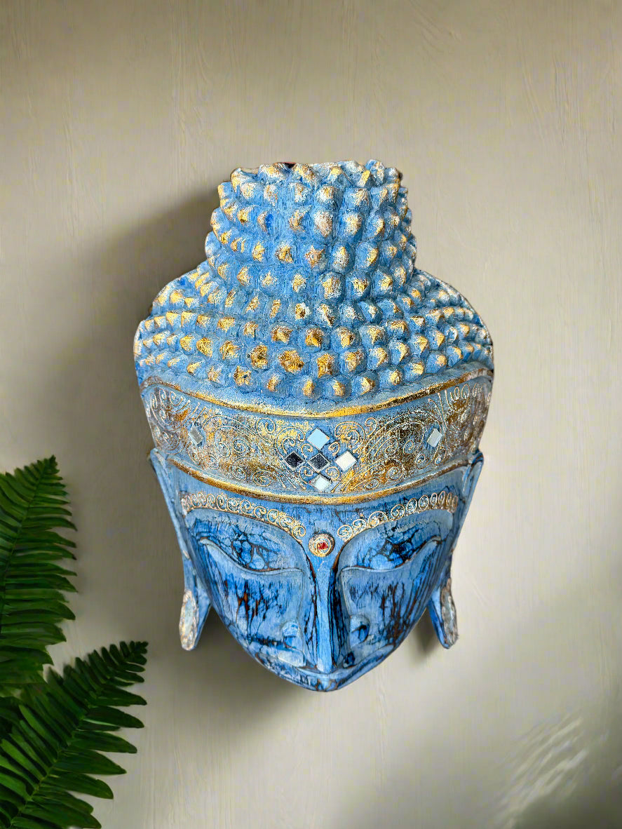 Blue Buddha head wall sculpture with gold ornate detailing and textured crown.