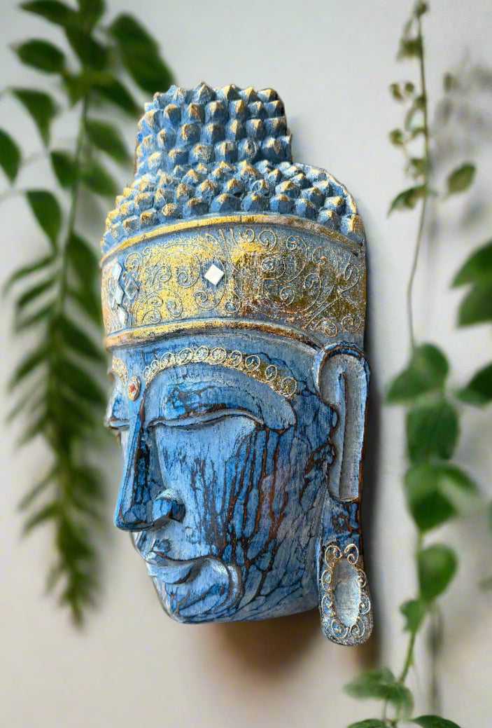 Blue and gold Buddha head sculpture with ornate crown and carved details