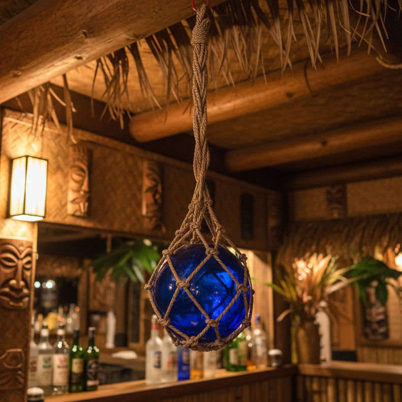 blue glass fishing float in a tiki bar