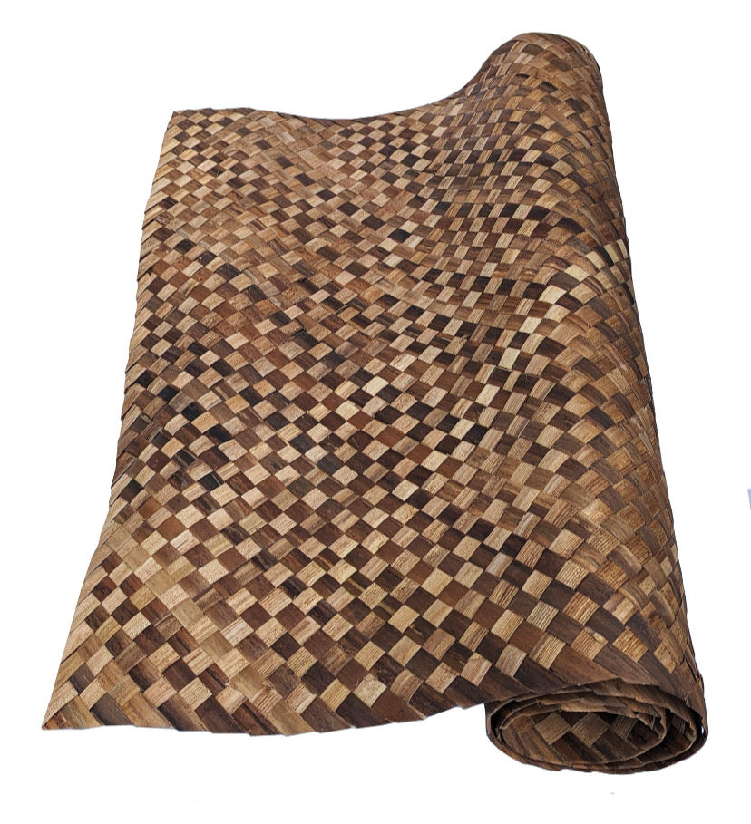 rolled brown woven mat with checkerboard pattern