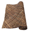 rolled brown woven mat with checkerboard pattern