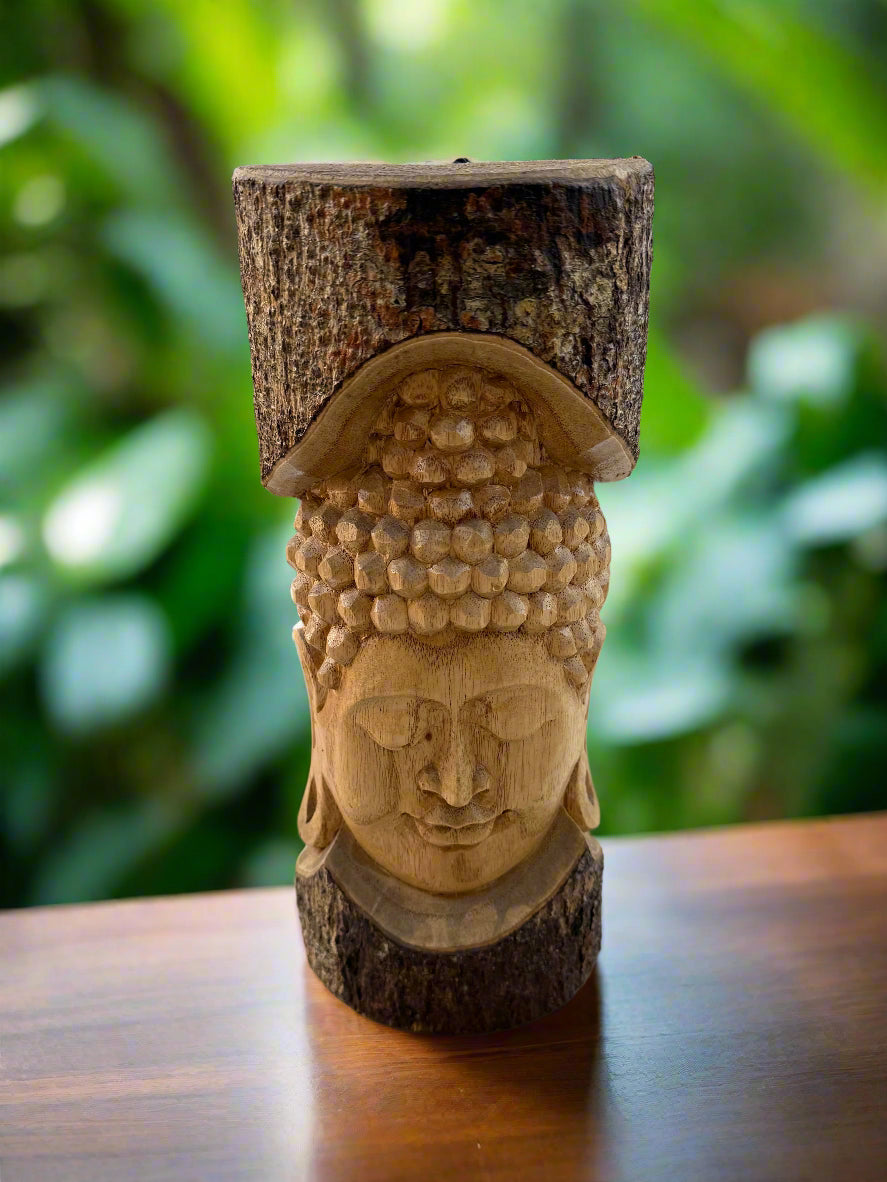 Carved wooden Buddha head with bark-framed crown and textured curls.