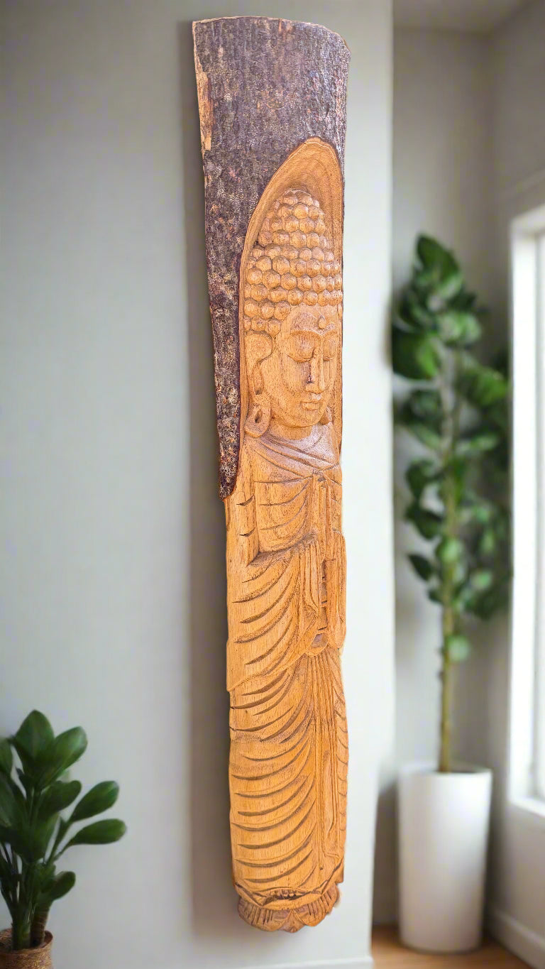 Carved Buddha relief on a vertical wooden plank
