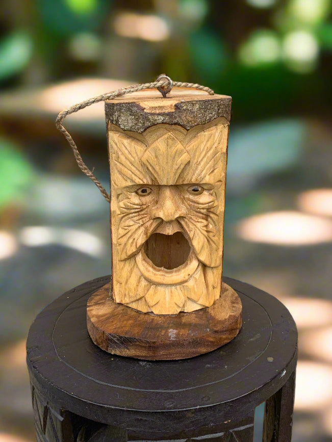 carved wooden tiki face lantern with rope handle