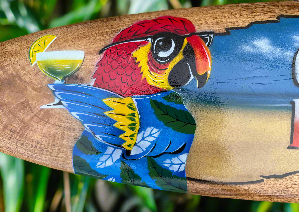 colorful parrot mural on wooden sign with lime cocktail