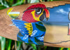 colorful parrot mural on wooden sign with lime cocktail