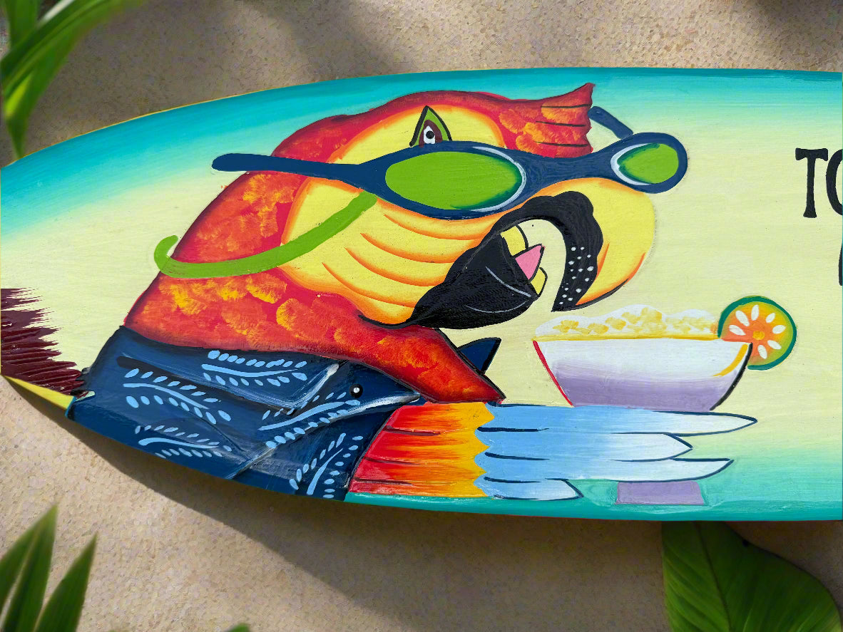 Colorful parrot wearing blue sunglasses on a bright tropical surfboard painting