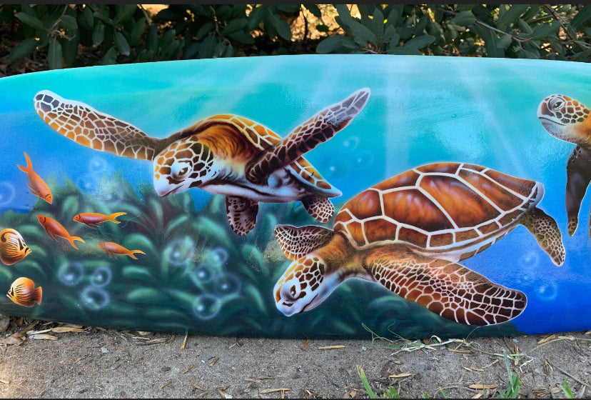 sea turtles swimming in a bright ocean mural