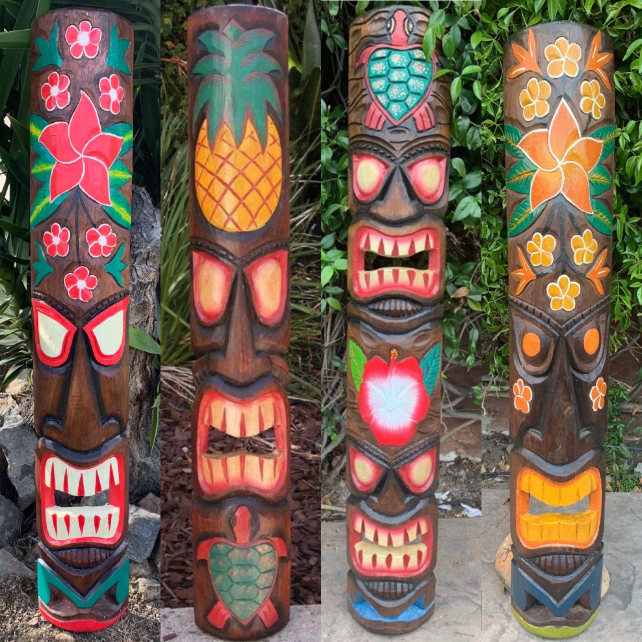 Four colorful tiki totem poles with carved faces and tropical floral designs.