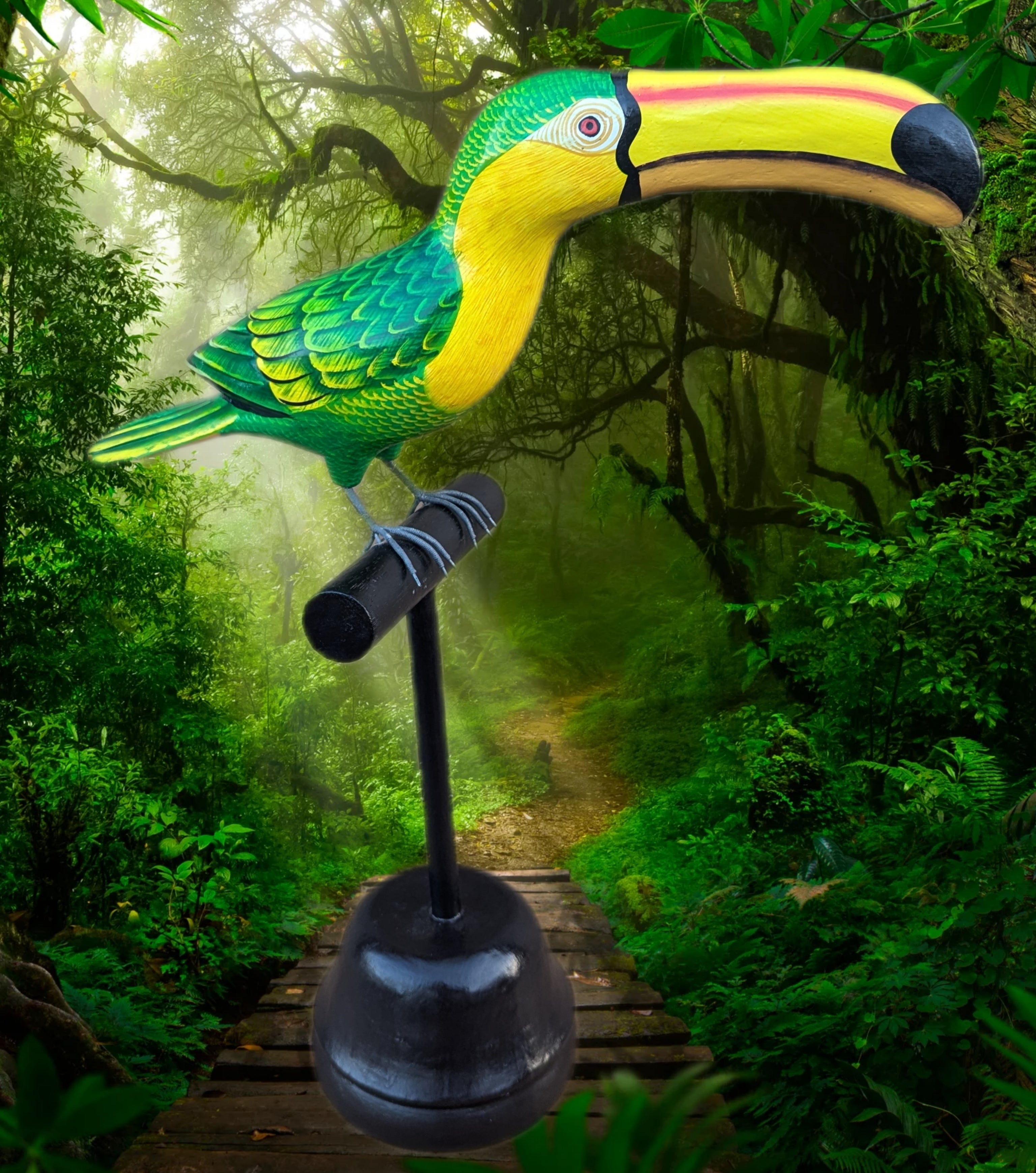 Bright green and yellow toucan sculpture perched on a stand in a lush jungle path.