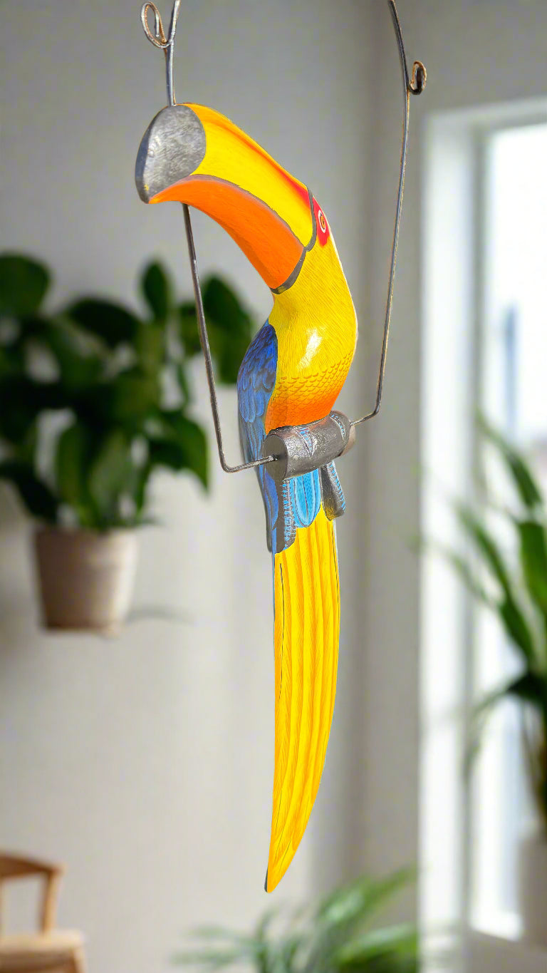colorful-toucan-hanging-sculpture-with-yellow-orange-beak-and-blue-tail-indoor-decor