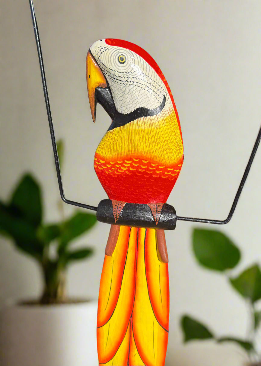 Colorful hand-painted wooden parrot sculpture with yellow to orange gradient feathers and metal wire frame