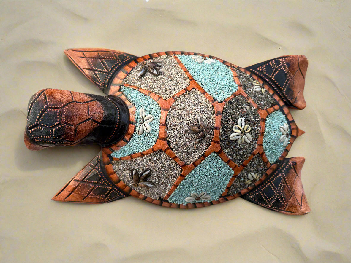 Decorative mosaic sea turtle sculpture with turquoise and gray stones and shell accents
