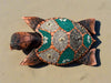 decorative wooden turtle sculpture with a mosaic shell in teal and gray stones