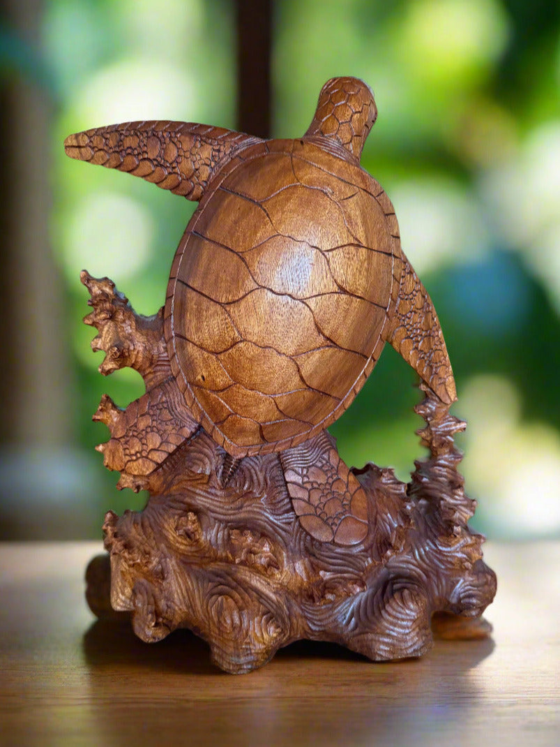 hand-carved wooden turtle statue with textured shell on a wooden base