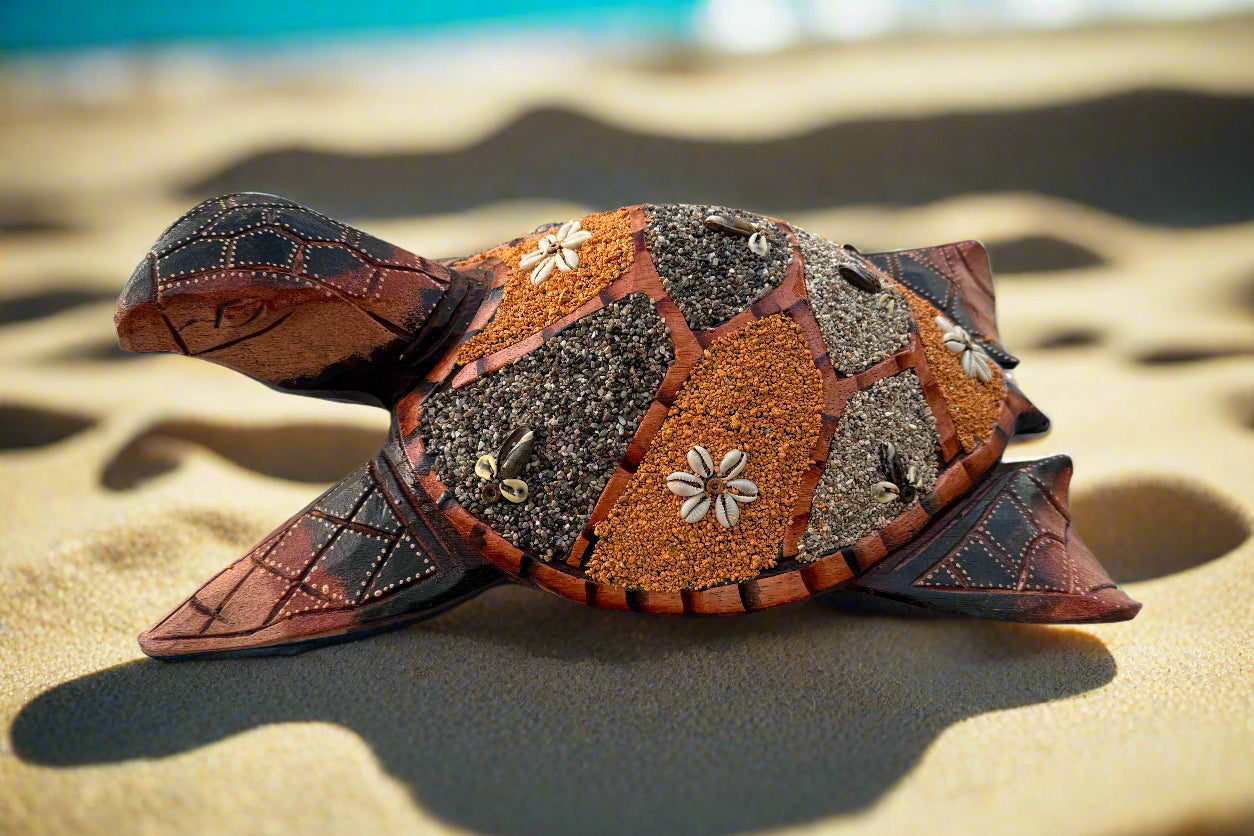mosaic-turtle-sculpture-on-sandy-beach-with-flower-inlays