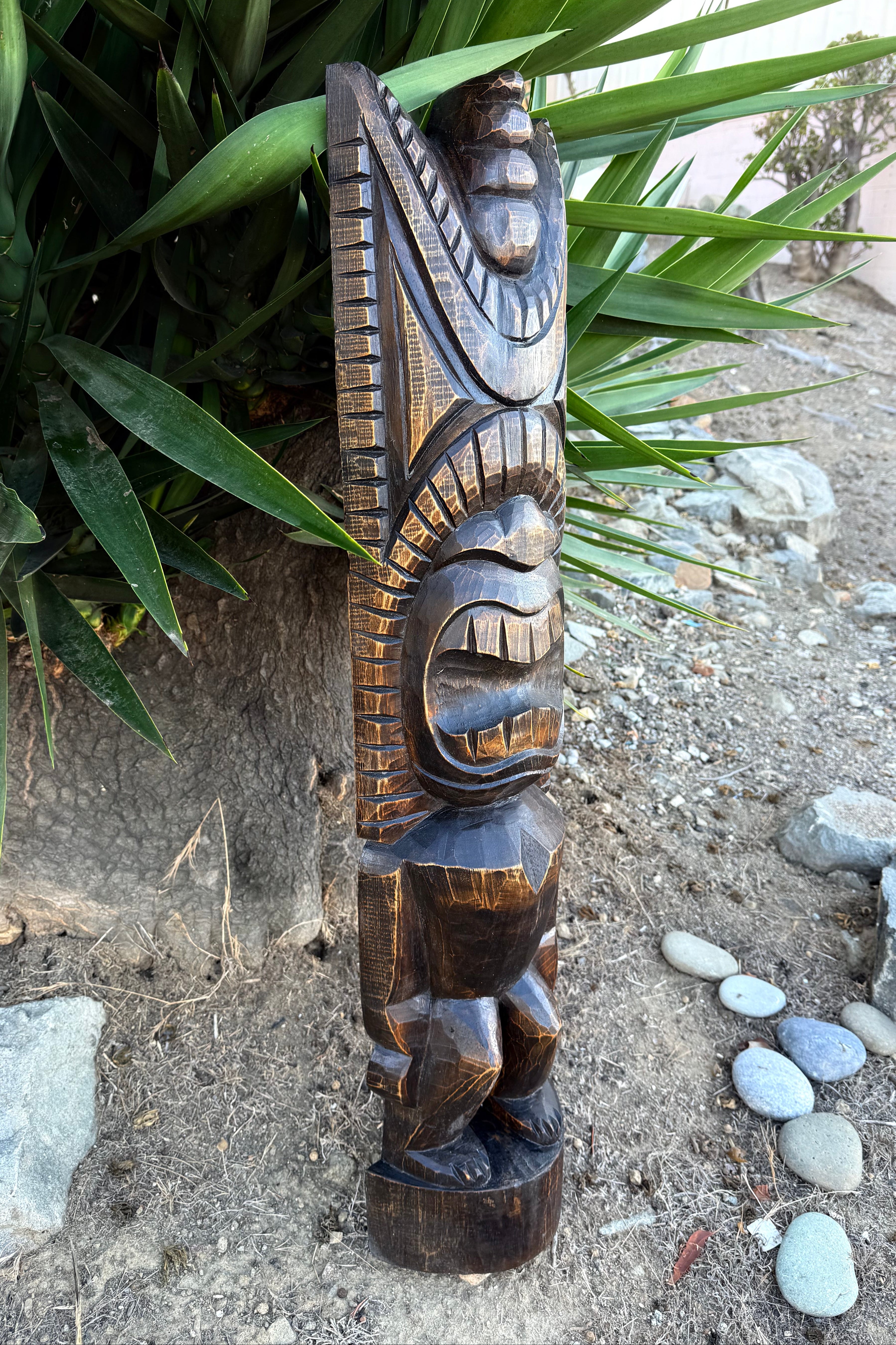 hawaiian god tiki statue left