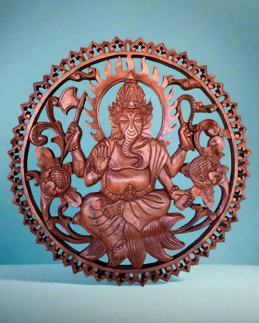 Intricate circular wooden Ganesha sculpture with ornate frame