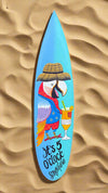 Blue surfboard artwork featuring a colorful toucan wearing a hat, holding a cocktail, and the caption 'It's 5 O'clock Somewhere'.