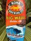 Kona Big Wave Golden Ale label with a large ocean wave and paddlers in a canoe