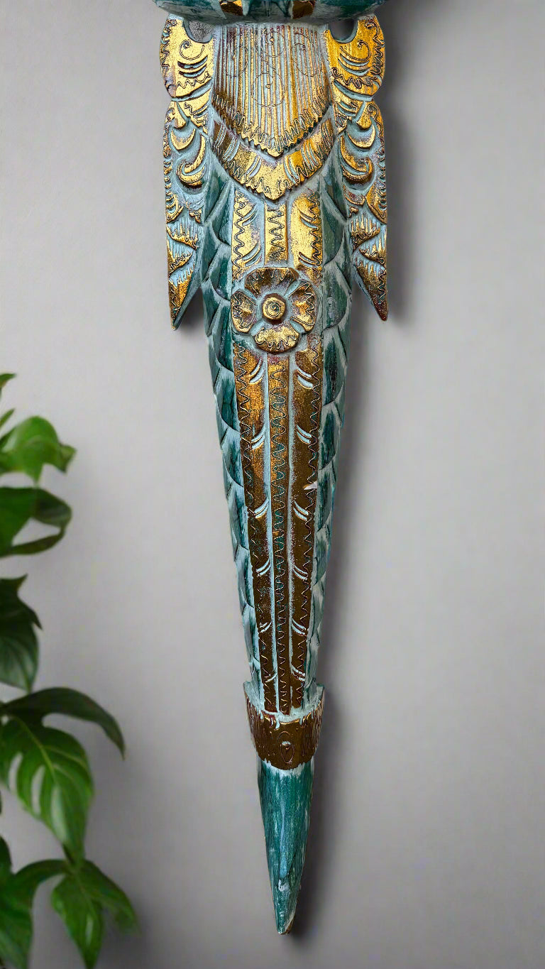 Ornate turquoise and gold carved dagger wall sculpture