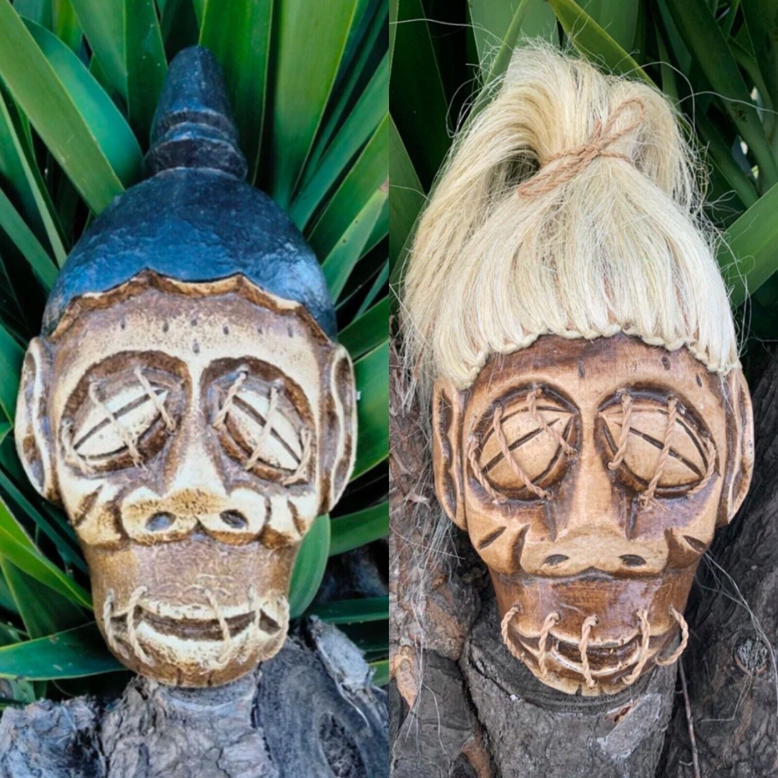 Pair of carved wooden skull masks with stitched eyes and mouths, one with dark hair, one with blonde wig
