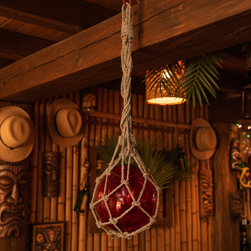 red glass fishing float in a tiki bar
