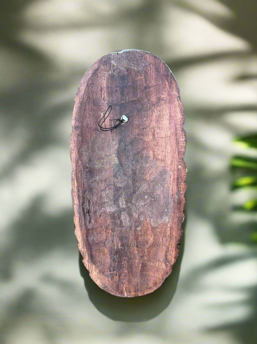 Rustic oval wood slice with a small necklace and green bead