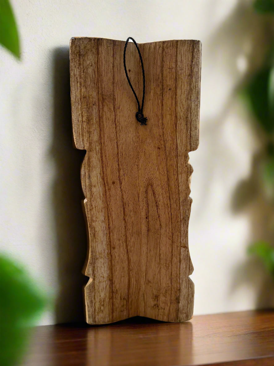 Rustic wooden wall plaque with scalloped edges and a black hanging cord.