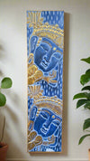 Tall blue Buddha head painting with gold detailing and lotus motifs on a blue patterned background