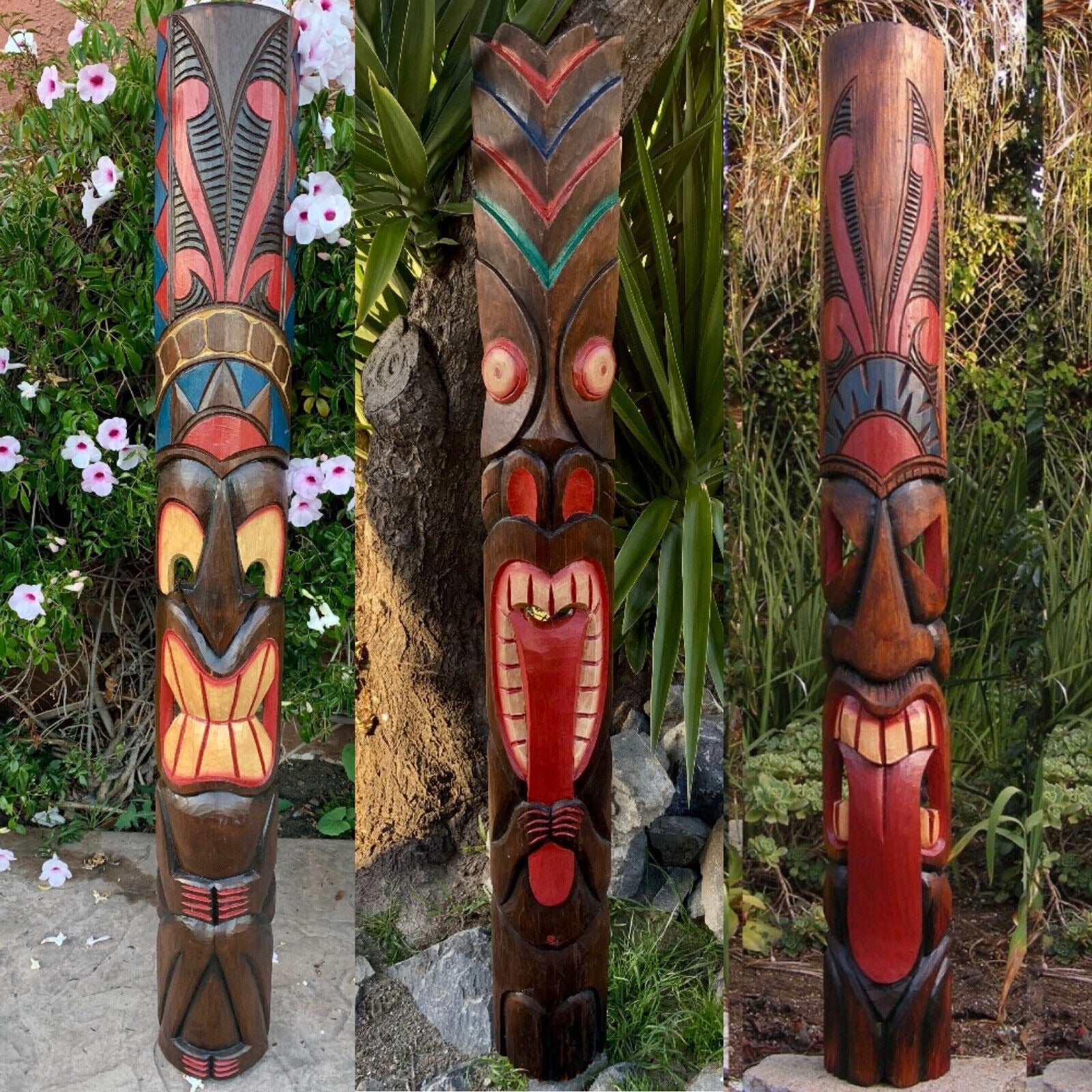 Three colorful carved wooden totem poles in a garden setting