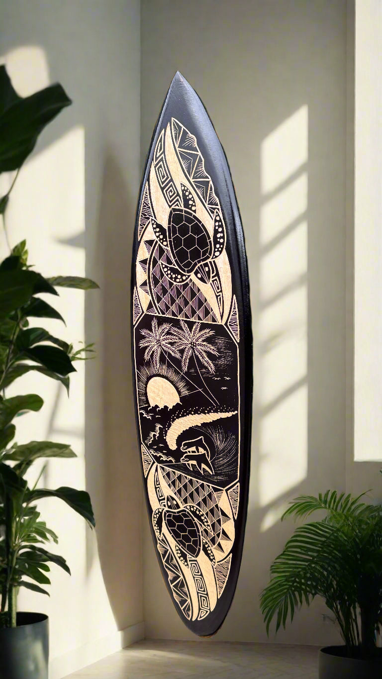 tribal-patterned longboard with geometric beige and black design leaning against a wall beside plants