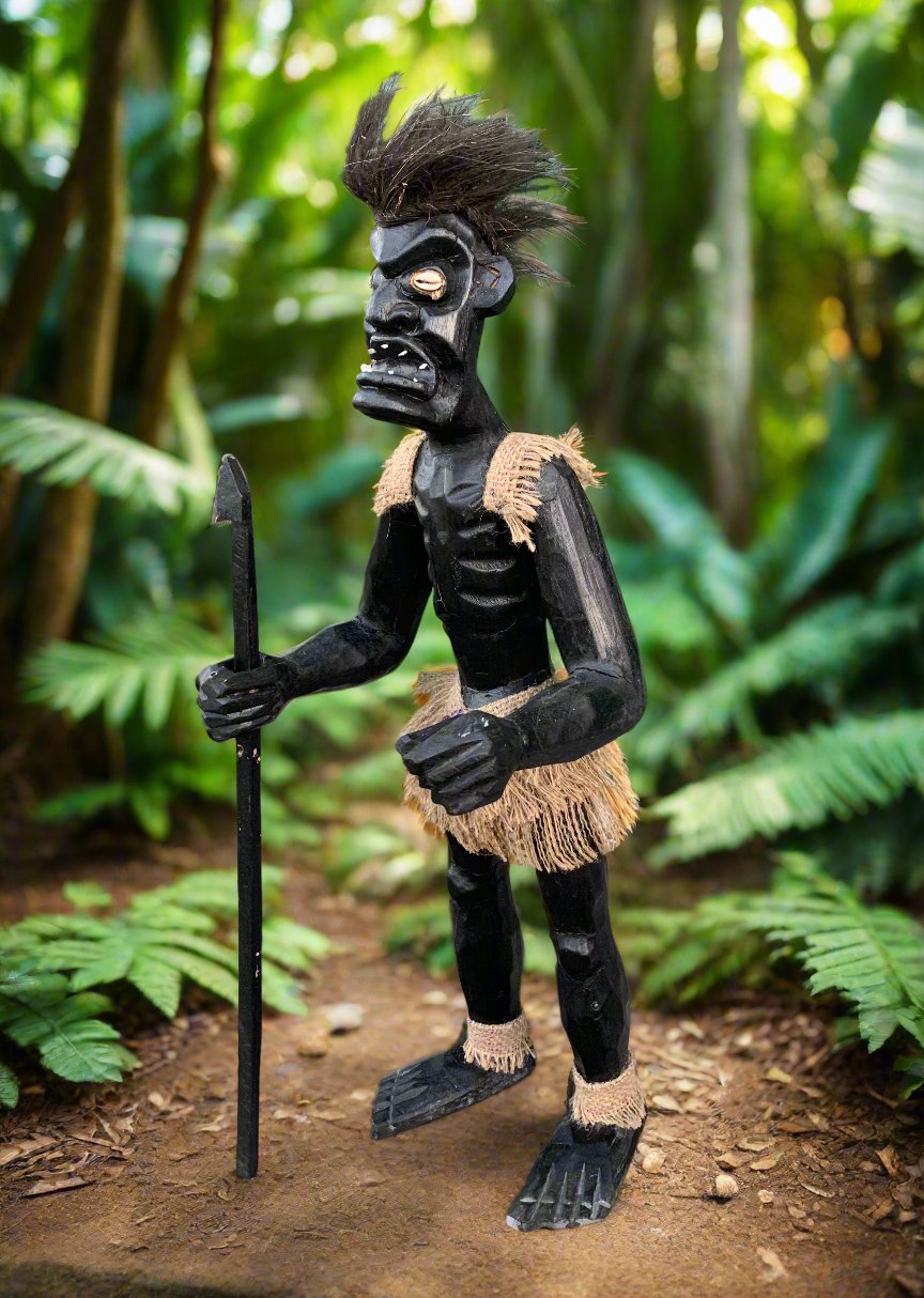 wooden tiki statue with spear in lush jungle