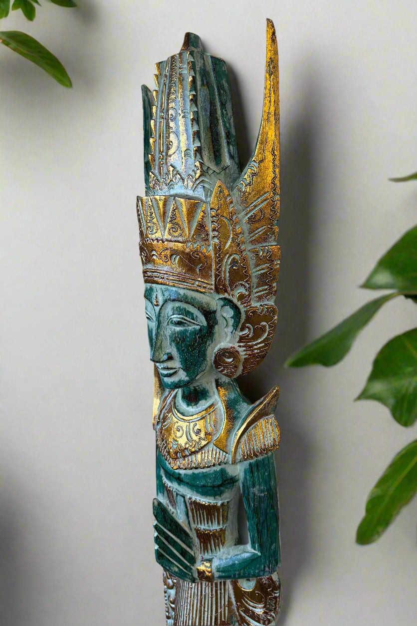Turquoise and gold ornate tribal statue with tall headdress