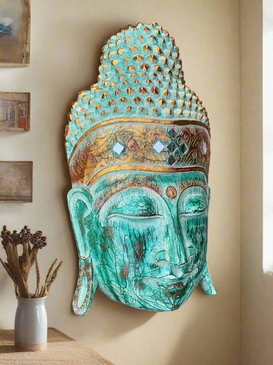 Turquoise Buddha head wall decor with gold detailing and mirrored accents