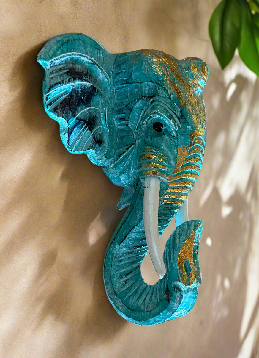 Turquoise elephant head wall sculpture with gold accents