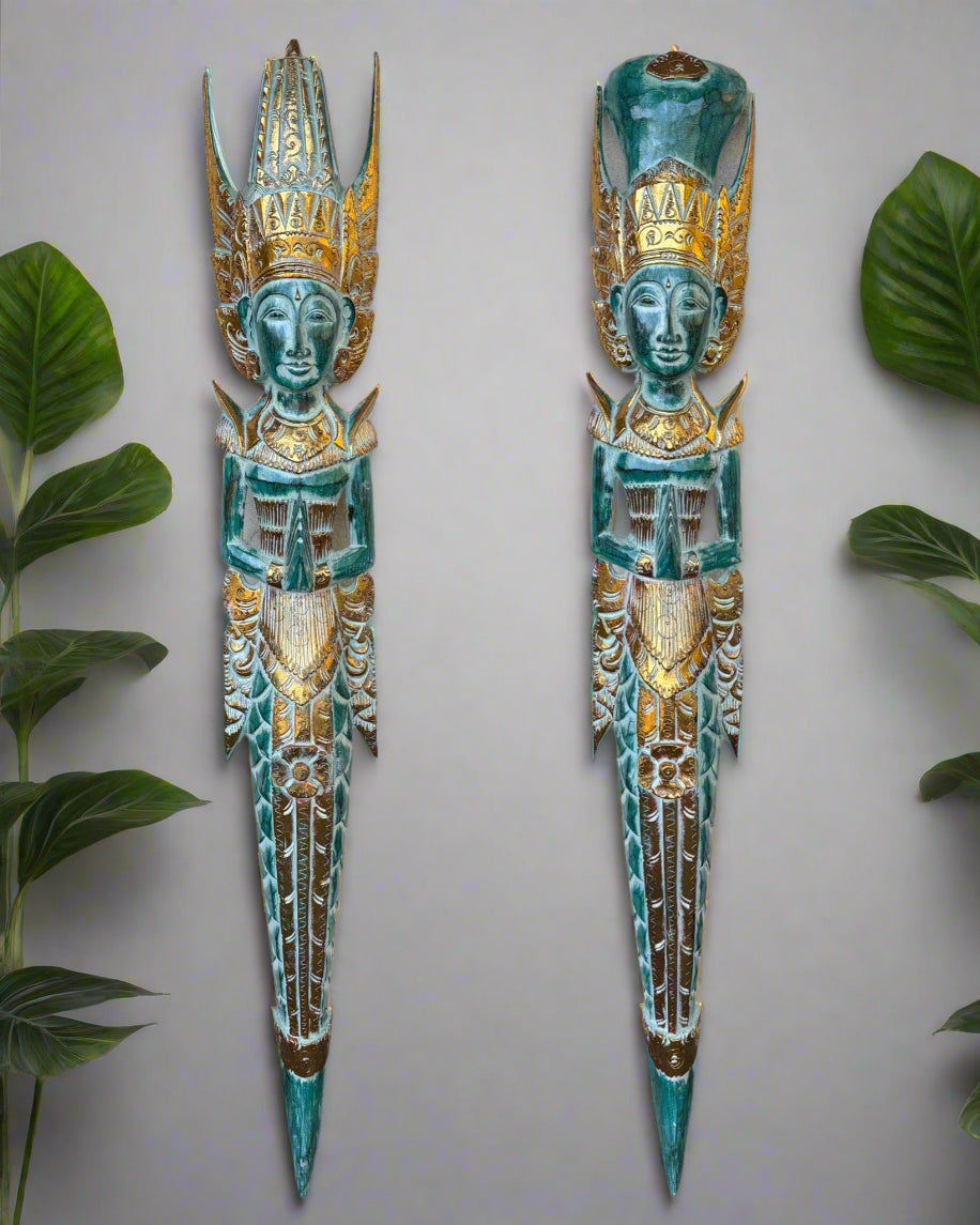 Pair of turquoise and gold carved statue figures with ornate crowns