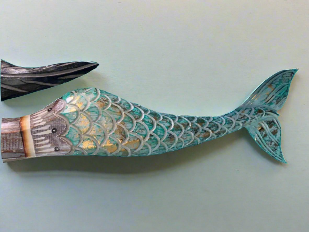 Decorative turquoise mermaid tail wall art with scale pattern and gold accents