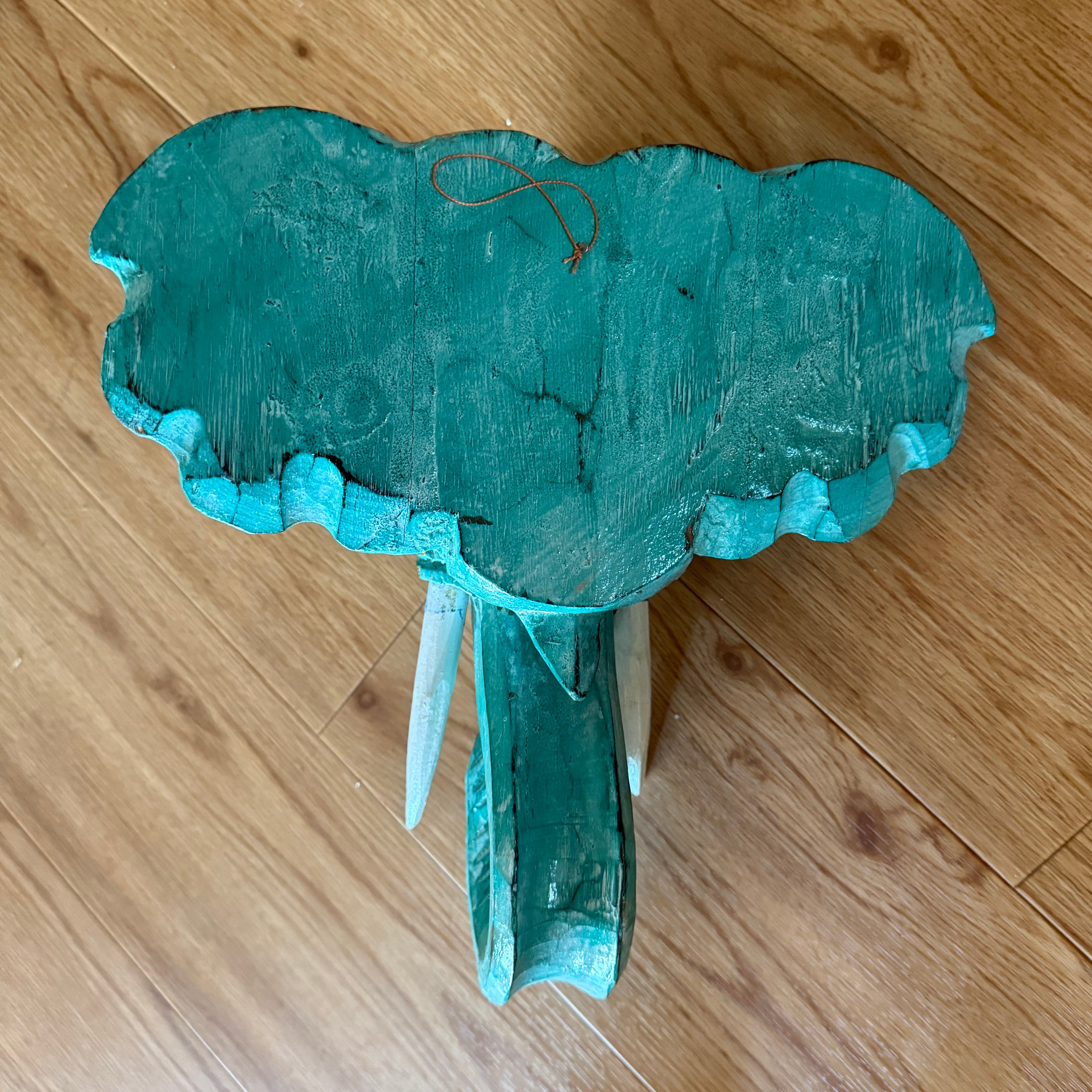Turquoise cloud-shaped wooden stool with scalloped edge and carved legs