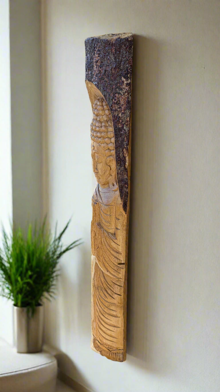 Vertical wooden Buddha carving mounted on a wall