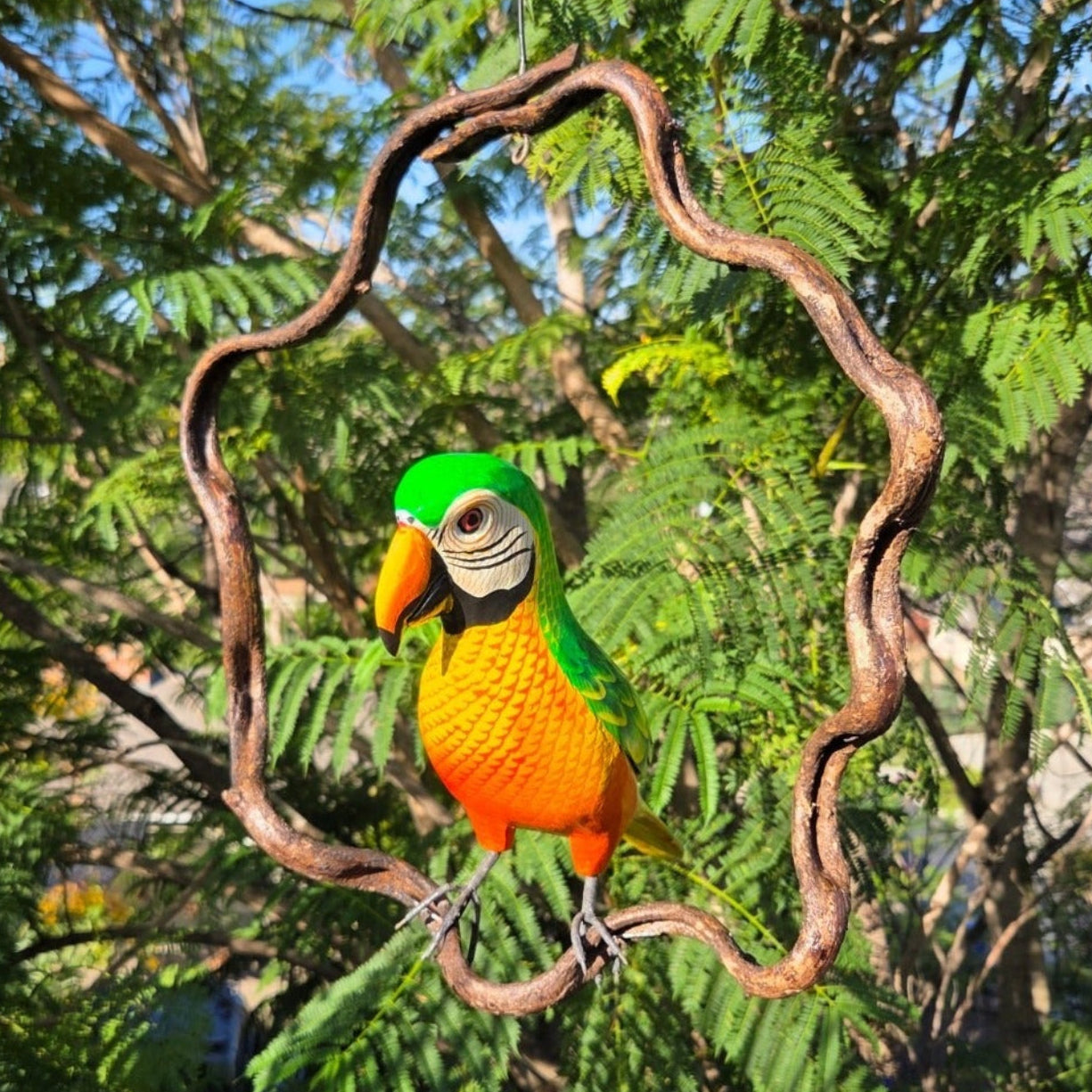 Colorful parrot perched on a branch with a natural green background