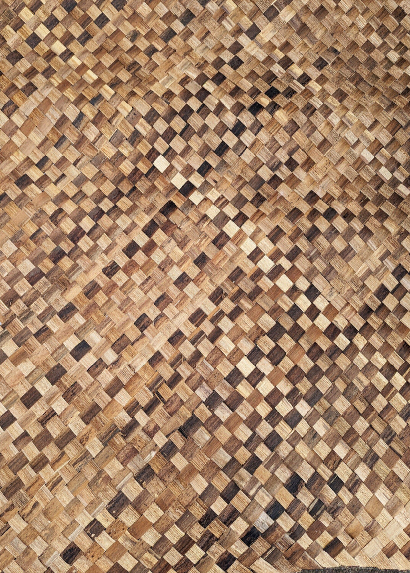 Close-up of a wooden basket-weave texture with interlaced brown strips.