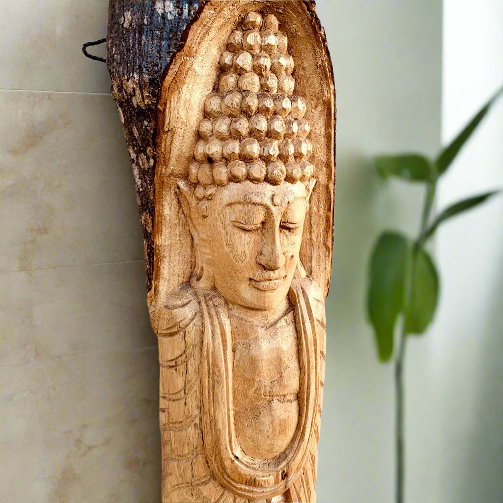 Serene carved wooden Buddha head on a vertical wood slab